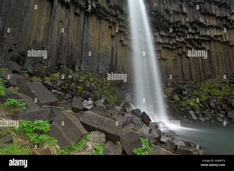 Svartifoss waterfall and tall basalt columns slow speed Skaftafell national park south Iceland ...