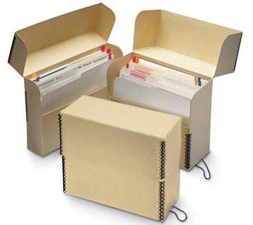 three boxes with file folders in them