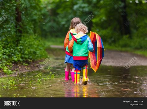 Kids Playing Rain Image & Photo (Free Trial) | Bigstock