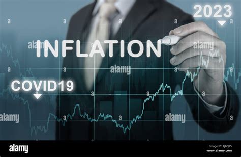 inflation 2022 2023. businessman writes word inflation against background of graph of rising ...