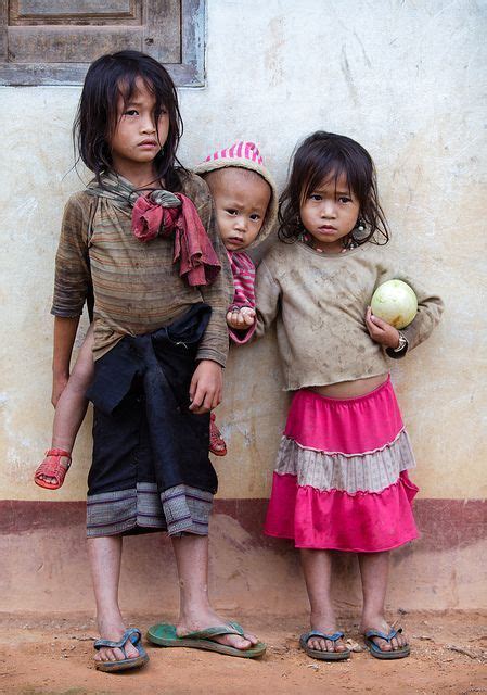 Kids taking care of kids in Laos - Young Lao girls taking care of a baby in their mountain ...