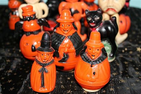 many orange and black ceramic figurines on a table