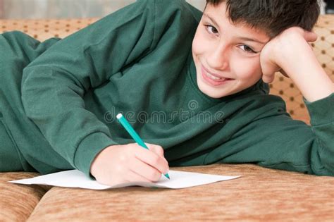 Smiling Boy Writes a Letter Stock Image - Image of closeup, emotion: 11999159