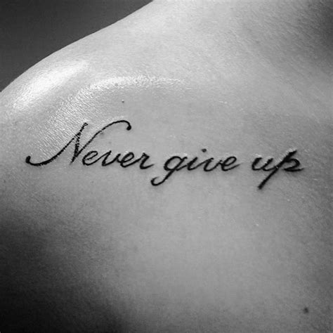 60 Never Give Up Tattoos For Men - Phrase Design Ideas