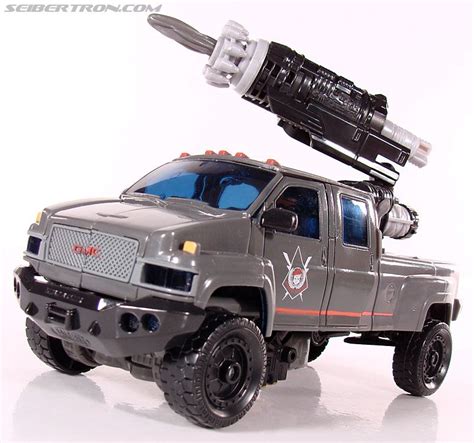 a toy truck with a rocket on top of it's back end and wheels