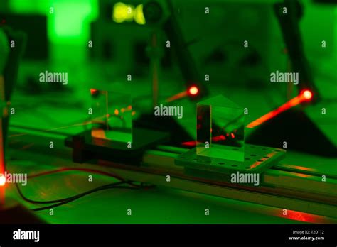 Experiment with a red laser in a physics lab Stock Photo - Alamy