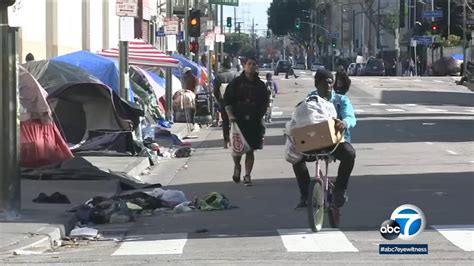 Los Angeles County homeless shelters open earlier to keep people safe ...