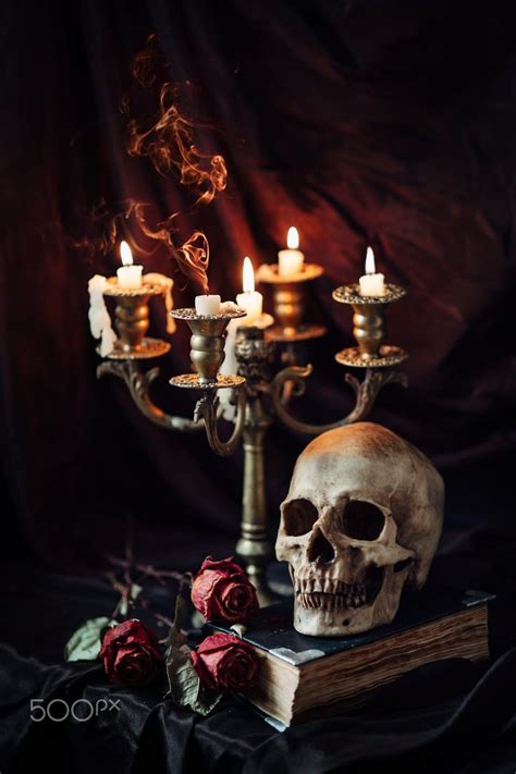 Human skull on book with antique candlestick. Still life | Still life ...