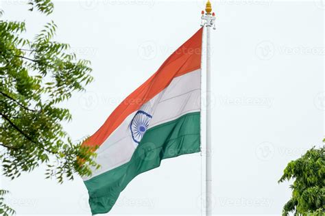 India flag flying high at Connaught Place with pride in blue sky, India flag fluttering, Indian ...