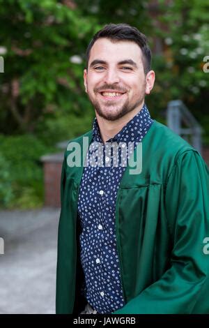 Male model wearing a graduation gown on campus at a university in Oregon Stock Photo - Alamy