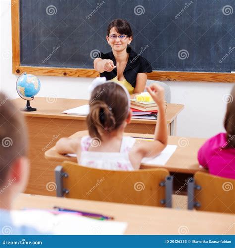 Teacher Pointing at Schoolgirl Stock Image - Image of teach, woman ...