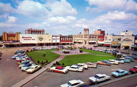 an aerial view of a parking lot with cars parked in the lot and ...