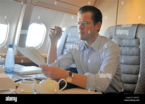 German Economy Minister Karl-Theodor zu Guttenberg studies files ...