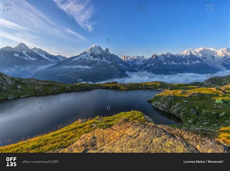 Mountain and lake at sunrise, Mont Blanc stock photo - OFFSET