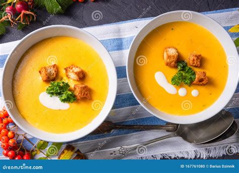 A Delicious Pumpkin Soup with Croutons and Coconut Milk Stock Photo ...