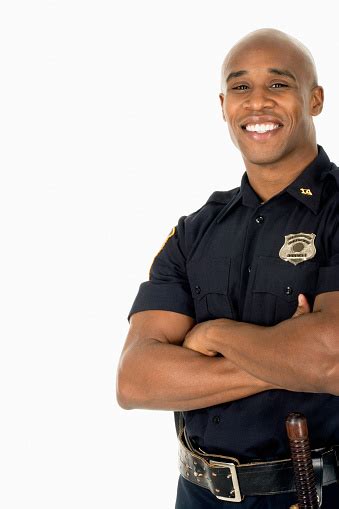 Studio Shot Of African Male Police Officer Smiling Stock Photo ...