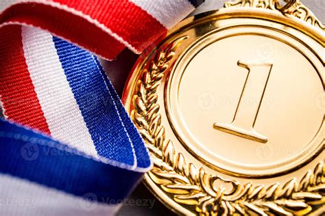 Gold medal winner at the light background 1370525 Stock Photo at Vecteezy