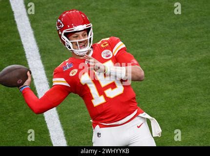 Kansas City Chiefs quarterback Patrick Mahomes warms up before an NFL football game against the ...