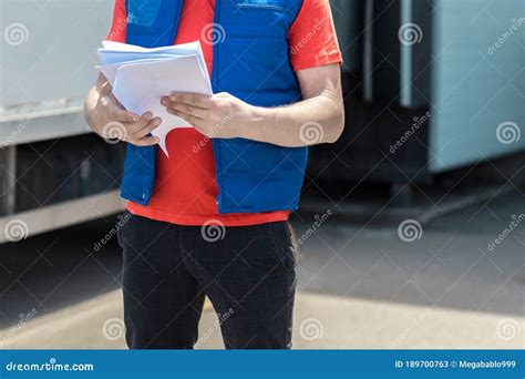 Courier Driver in Uniform Making Notes in Document and Delivery White Truck Behinde Him Stock ...