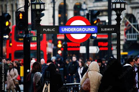 Piccadilly Circus tube station entrance, busy commuters present. Stock ...