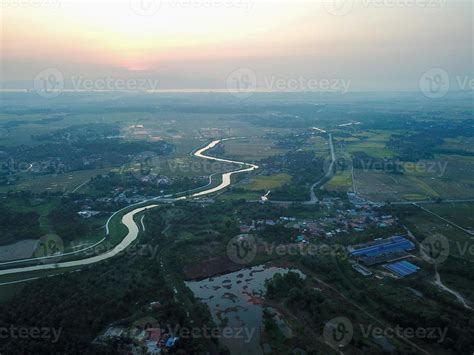 Aerial view paddy field near village 21648704 Stock Photo at Vecteezy