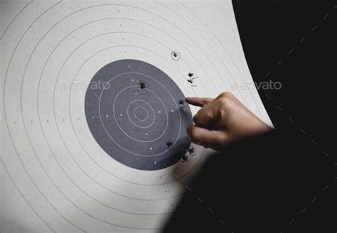 Pistol bullseye target shooting training in an indoor shooting club ...