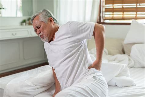 Asian Elderly Senior Man Back Pain and Illness on Bed at Home,unhappy ...