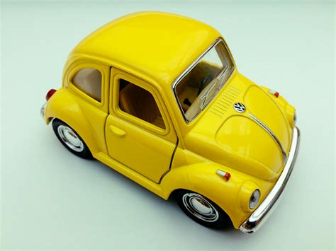 Yellow Volkswagen Beetle Toy Car on White Background · Free Stock Photo