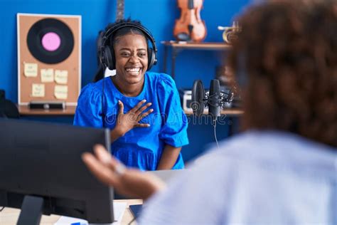 African American Women Musicians Smiling Confident Speaking at Music Studio Stock Photo - Image ...