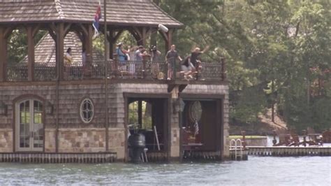 Watch as Nick Saban and Tim Tebow jump off a boat house into Lake Burton - CBSSports.com