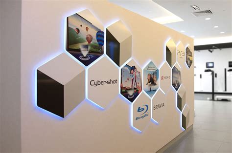 Interesting back-lit wall signage for SONY | Office wall design, Wall ...