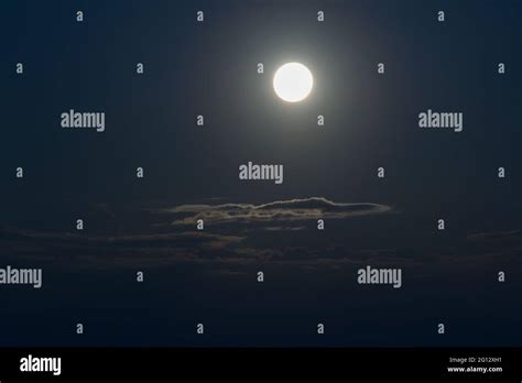 Moon over moonlit clouds in night sky, sikkim, India Stock Photo - Alamy