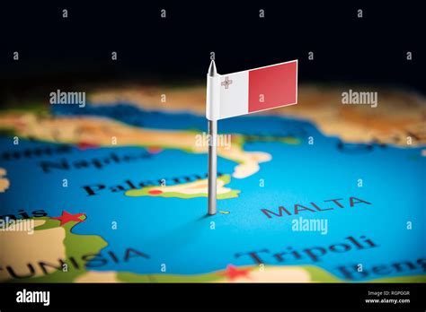 Malta marked with a flag on the map Stock Photo - Alamy