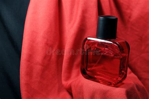 Red Color Men Perfume Bottle Isolated on Red Silk Background. Stock ...