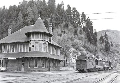 Vintage Train Passing Through Mountainous Terrain