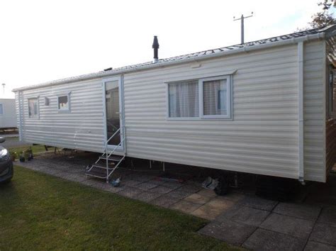 Caravan for hire at Haven Church Farm Holiday Village. UK Caravan Rental