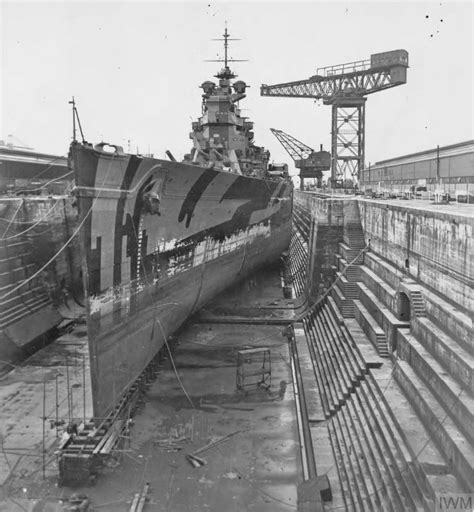 THE REFIT OF HMS KING GEORGE V. 1940, ROSYTH, IN DRY DOCK. View of HMS KING GEORGE V bows on ...