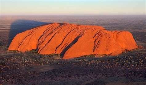 Uluru, also known as Ayers Rock, is a large sandstone rock formation in the southern part of the ...