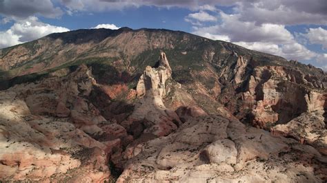 6K stock footage aerial video of flying by tall mountain peak, Navajo ...