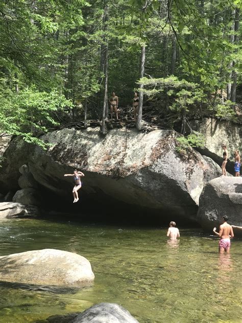 Jumping into swimming hole along Franconia Falls Trail