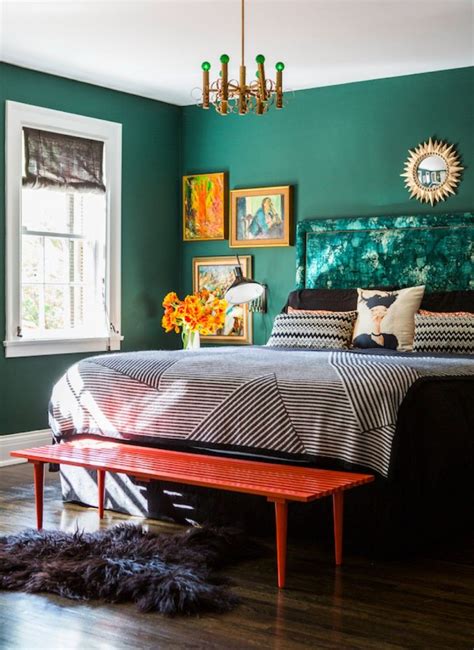 A beautiful emerald green bedroom design with a charming red bedroom bench and black and white ...