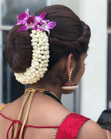 a woman with flowers in her hair