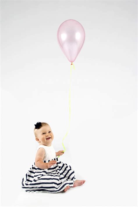 Baby Girl Holding Balloon Free Stock Photo - Public Domain Pictures