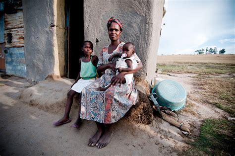 Poor African Family Sitting In Front Of A Shanty Hut Stock Photo ...