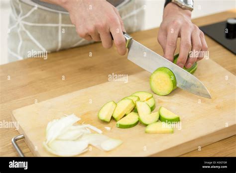 Single man cooking Stock Photo - Alamy