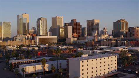 5.7K stock footage aerial video of a view of the city's skyline at sunset, Downtown Phoenix ...