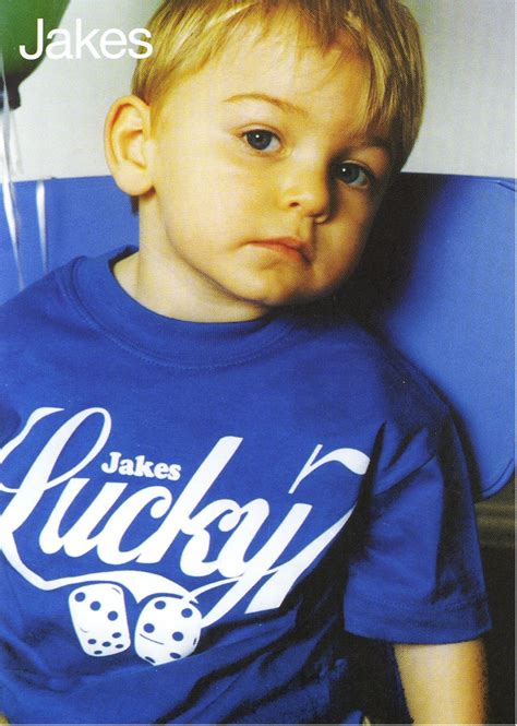 Jake modelling his iconic Lucky 7 design. Photographed by Mary McCartney.