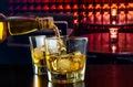 Man pouring whiskey from a decanter - Free Stock Image