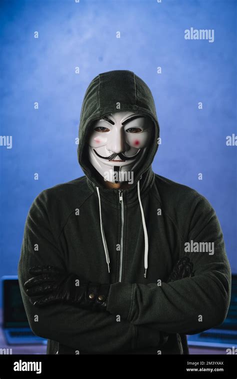 Hacker with anonymous mask Stock Photo - Alamy