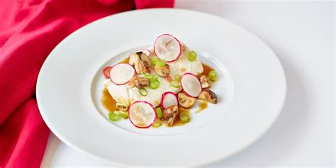 This stunning poached hake recipe from Michael Caines is served with a ...